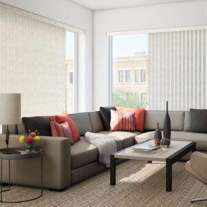 living room with white vertical blinds on large windows